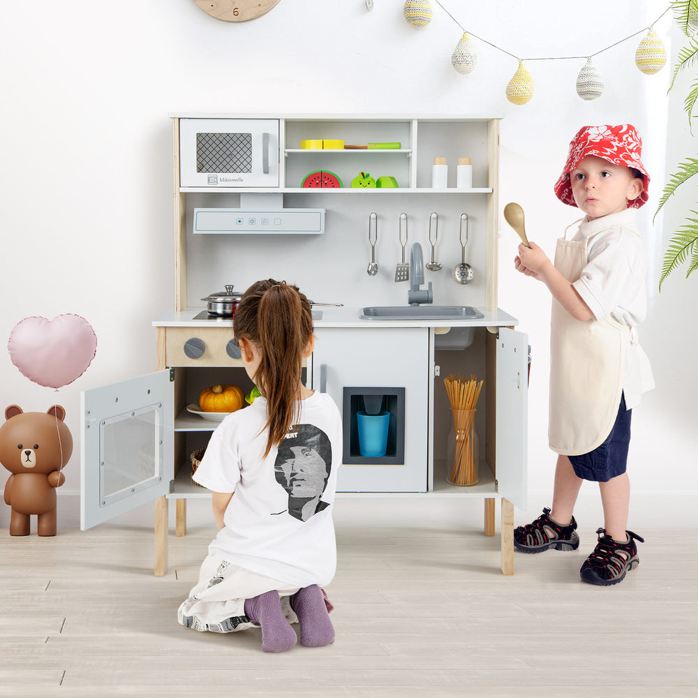 Wooden pretend play kitchen set for toddlers in white with accessories, promoting creativity and hands-on skills.