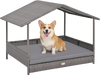 Wicker dog house with canopy in gray, featuring a raised bottom and removable cushion for small to medium pets.