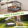 Elevated gray wicker dog bed with canopy for indoor and outdoor use, offering comfort and weather protection for pets.