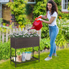 Wicker raised garden bed with removable liner and storage shelf, ideal for growing flowers and herbs in your garden.