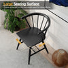 Windsor dining chair with large black seat, ergonomic backrest, and natural rubber wood for comfortable dining.