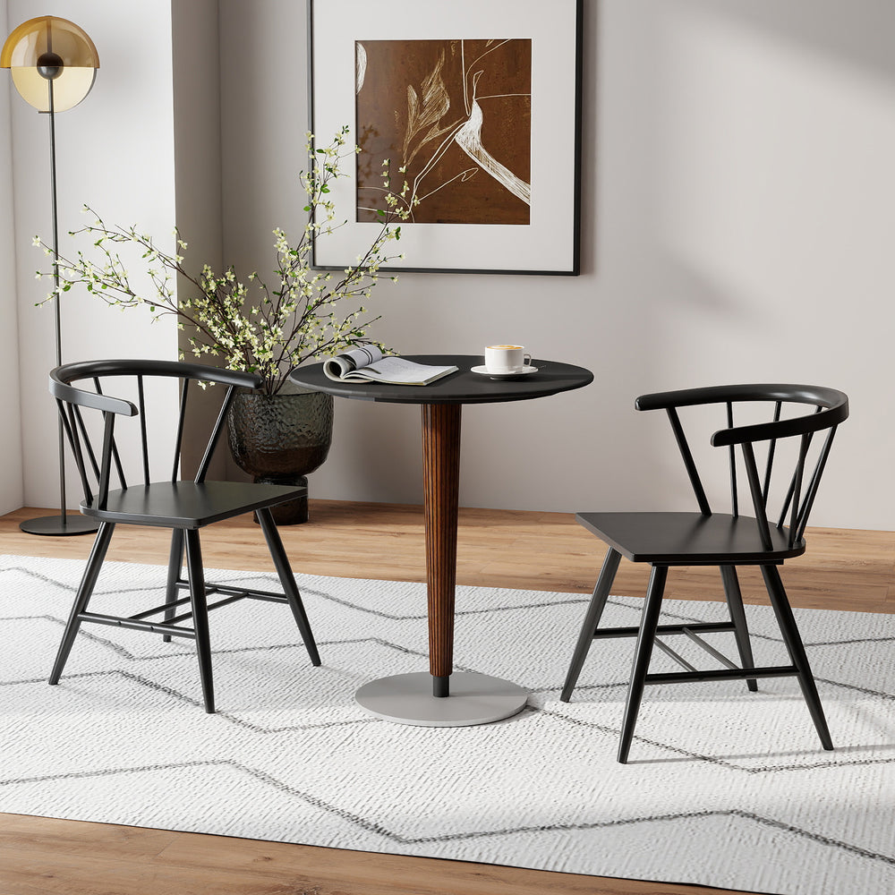 Mid-century modern Windsor dining chair set in black, featuring ergonomic design and natural rubber wood for comfort.