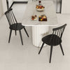 Black Windsor dining chairs with ergonomic spindle backrest, perfect for dining rooms and kitchens.