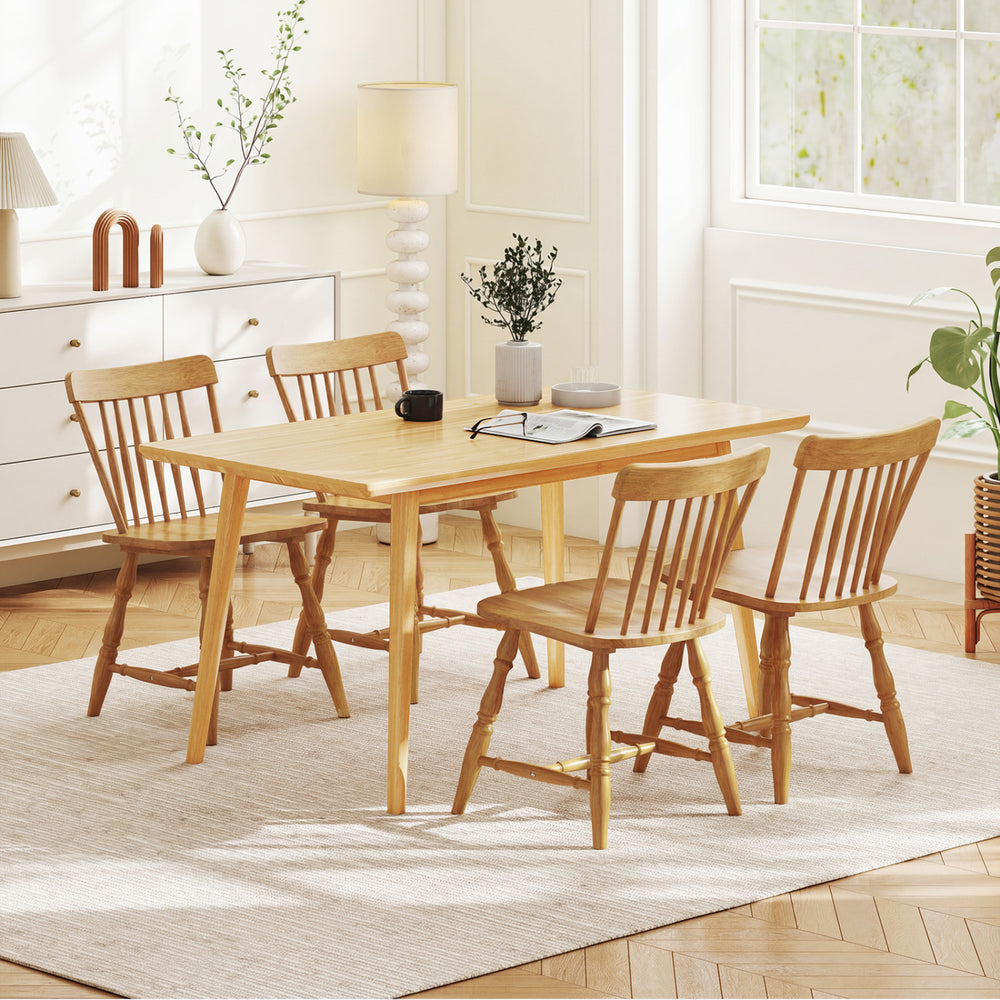 Windsor dining table set featuring four natural rubber wood chairs with curved spindle backs for stylish comfort.