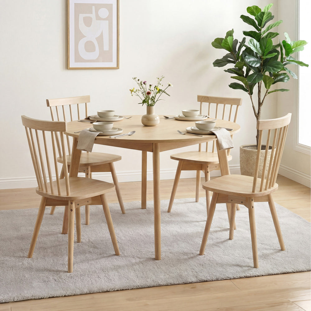 Set of four Windsor dining chairs in natural rubber wood, featuring a swivel seat and inclined spindle back for comfort.