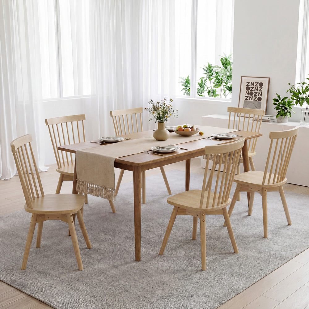 Windsor dining chair featuring a sturdy rubber wood design with an inclined back, perfect for stylish and comfortable.