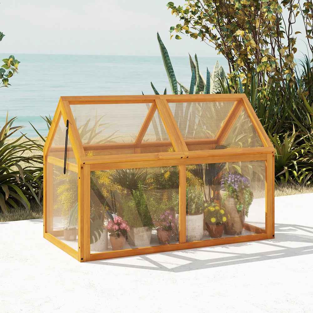 Wood cold frame greenhouse side view showcasing adjustable roof and transparent panels, perfect for protecting plants.