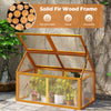 Wood cold frame greenhouse in orange with solid fir wood frame and transparent panels, perfect for nurturing plants.
