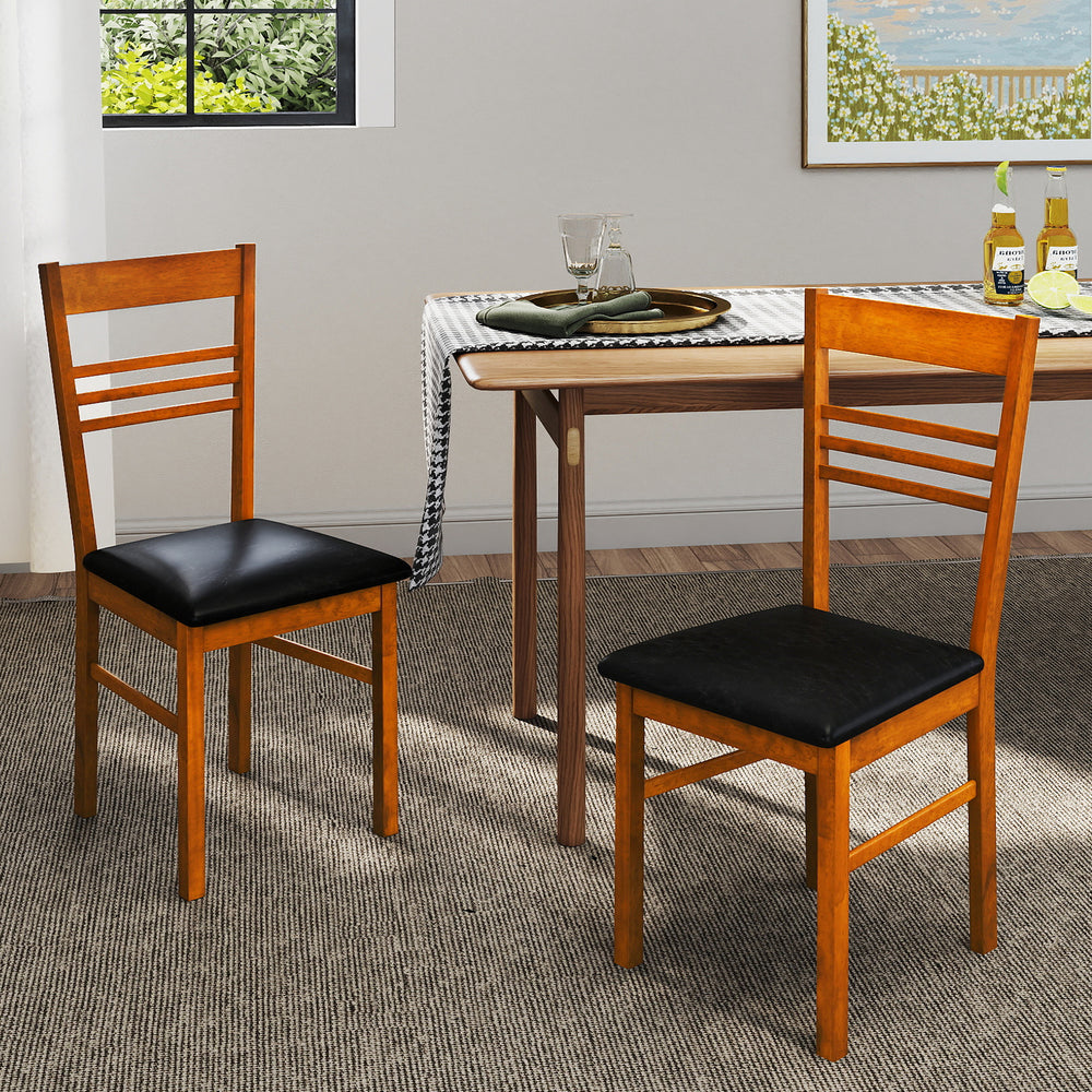 Wood dining chairs set of 4 with walnut finish and black PU leather seats, ideal for kitchen or dining room use.