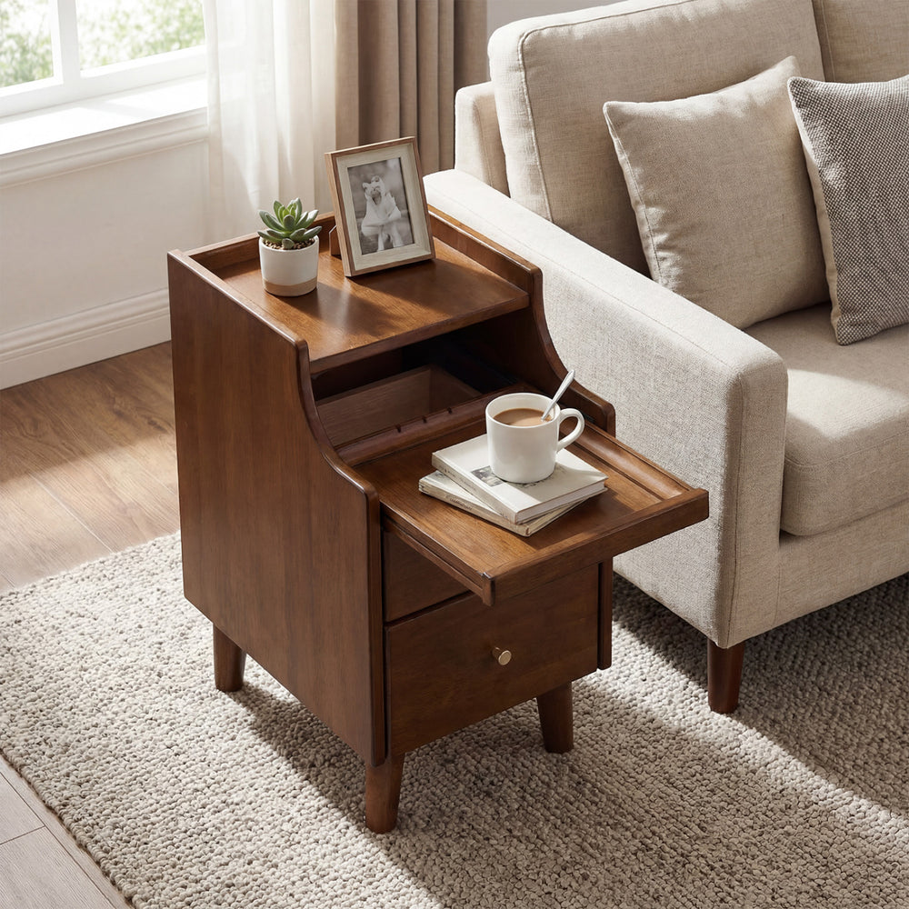 Wood nightstand with drawers and solid wood legs in brown, featuring an open shelf and a cozy living room setting.