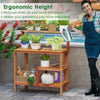 Wooden outdoor garden potting workstation with open shelves, ergonomic height for reduced strain, ideal for patio use.