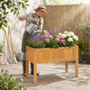 Wood raised garden bed with vibrant flowers, featuring drainage holes, perfect for growing vegetables and herbs.