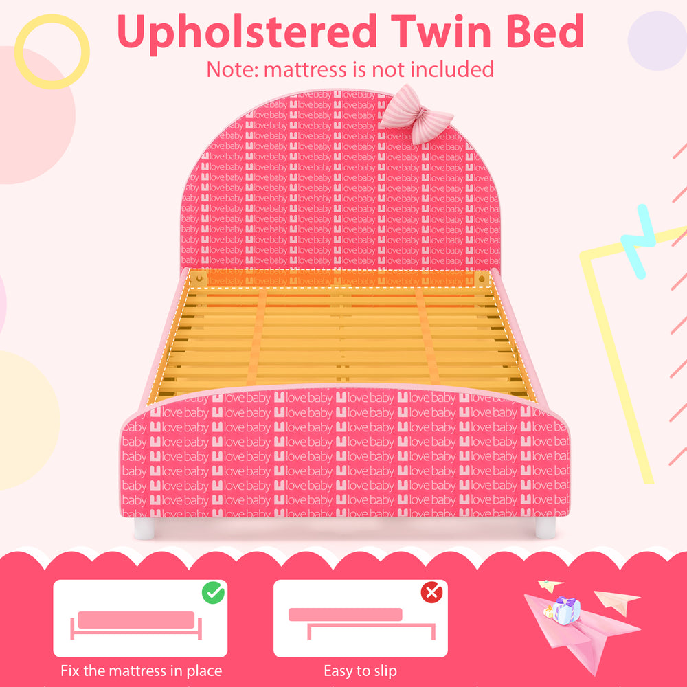 Upholstered twin bed platform in pink with slat support, designed for kids' safety and comfort, ideal for transitioning.