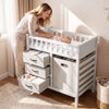 Wooden baby changing table featuring a sturdy solid pine frame, three fabric storage drawers, and a laundry hamper for.