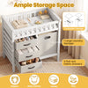 Wooden baby changing table in beige with 3 fabric drawers and a laundry hamper, ideal for organized diaper changes.