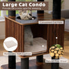 Wooden cat tower with spacious condo, soft removable cushion, and sturdy scratching posts for climbing and lounging.