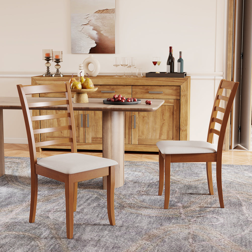 Two wooden dining chairs with beige upholstery and slatted backs, perfect for modern kitchen or dining areas.