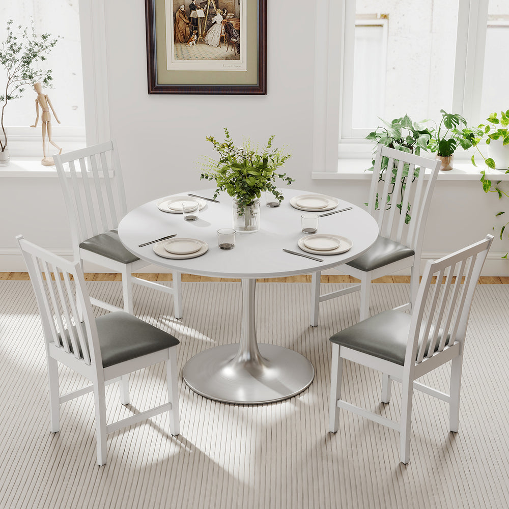 White wooden dining chairs with padded seats, crafted from rubber wood, ideal for dining rooms and cafes.