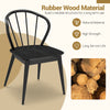 Black wooden dining chair with high spindle back, made of sturdy rubber wood for comfort and durability in any setting.