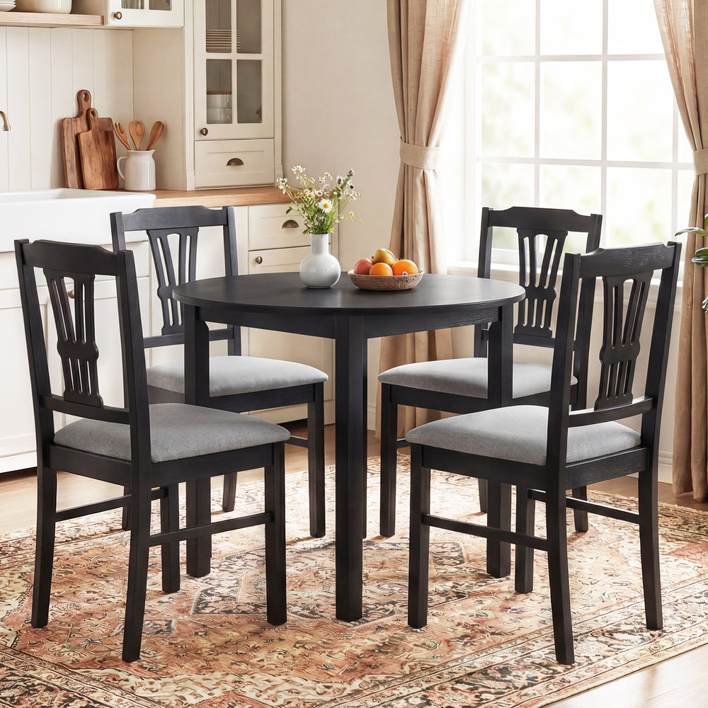 Round dining table set with gray upholstered chairs, solid rubber wood frame, perfect for stylish kitchen dining.