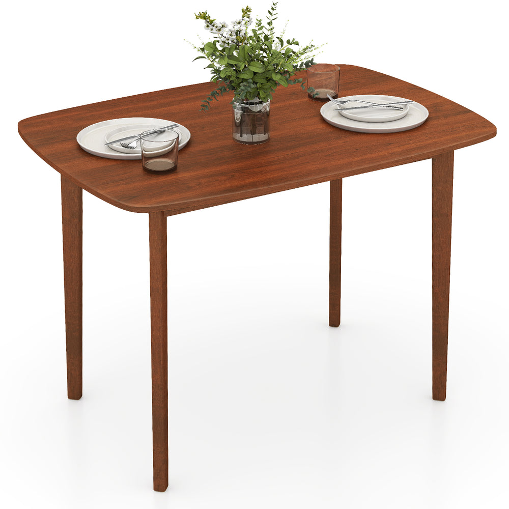 Walnut-finished wooden dining table for 2-4 people with rubber wood legs, perfect for small dining areas.