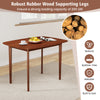 Wooden dining table with walnut finish and rubber wood legs, designed for 2-4 people, ideal for small spaces.