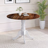Round wooden dining table with walnut tabletop and white curved trestle legs, perfect for kitchen or dining room use.