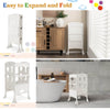 Folding wooden step stool in white with lockable safety rail, ideal for toddlers to reach counters and wash hands.