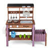 Wooden mud kitchen set in purple with working faucet, pots, tools, and planter box for immersive outdoor play.