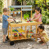 Wooden outdoor mud kitchen for kids in yellow with stoves, sink, flowerpots, and wheels for fun outdoor play.