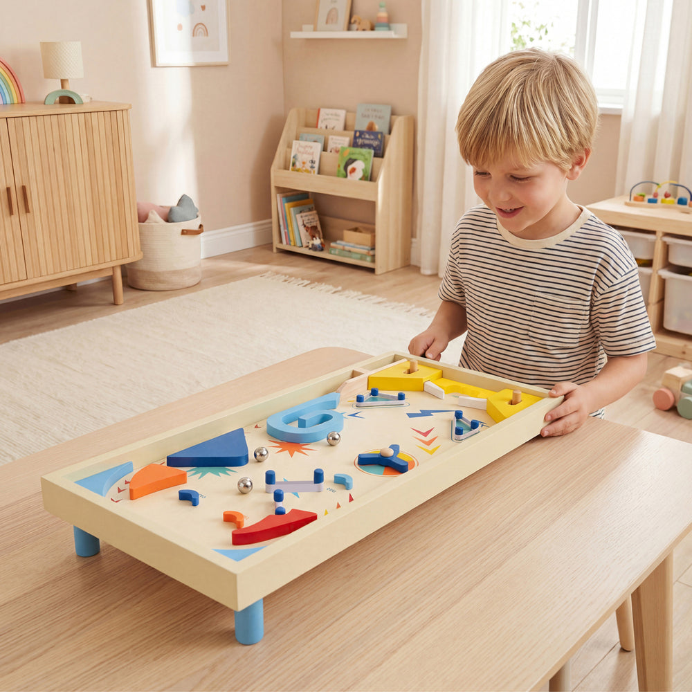 Wooden pinball machine with colorful components and three metal marbles, designed for kids and adults to enjoy.