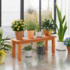 Wooden plant stand in a bright indoor setting, crafted from solid wood, perfect for showcasing vibrant potted plants.