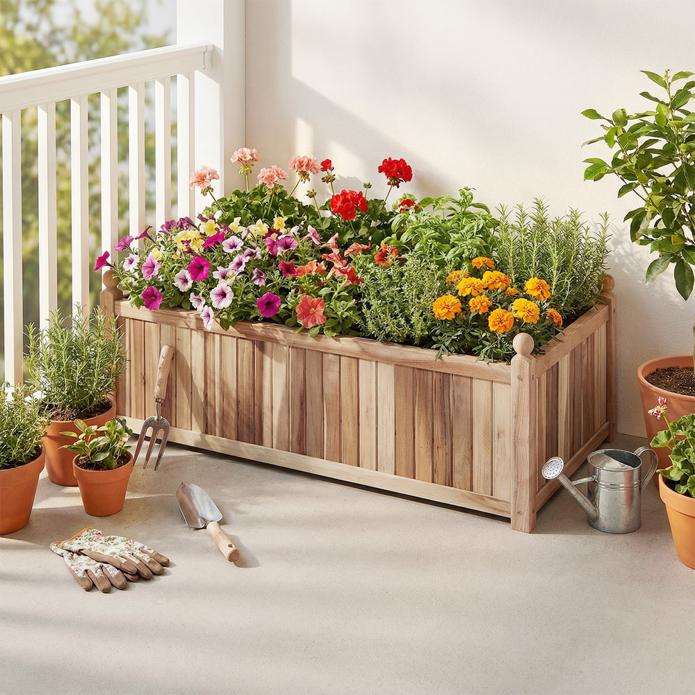 Wooden raised garden bed made of natural acacia wood, filled with colorful flowers, ideal for patios and balconies.