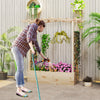 Wooden raised garden bed planter box with trellis, featuring a woman watering vibrant flowers for a stylish outdoor.