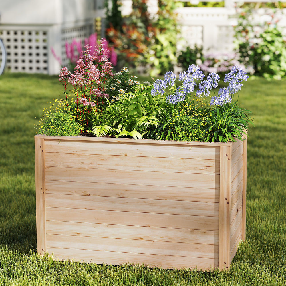 Wooden raised garden bed planter box made of fir wood, featuring vibrant flowers and ideal for deep-rooted plants.