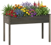 Elevated wooden vegetable garden bed in gray filled with colorful flowers, perfect for backyard planting and easy.