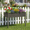 Elevated wooden vegetable planter in gray with colorful flowers, perfect for gardens and patios.