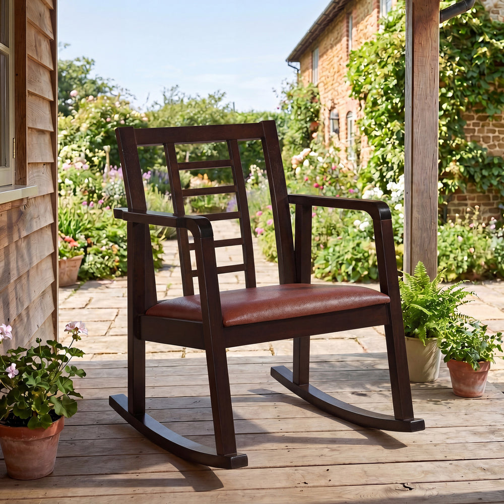 Wooden rocking chair with upholstered seat and ladder back design, perfect for relaxation in your living room.