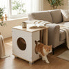 Wooden semi-enclosed cat condo with kitty head entry, natural finish, serving as a side table for decor and snacks.