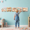 Wooden sensory wall panel featuring a vanity and tool box, designed for kids' role-play and hands-on learning.