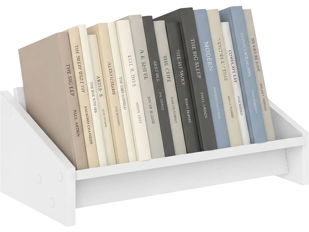 Small white wooden tilting bookcase displaying organized books, ideal for desktop use and space-saving storage.