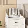 Small white wooden tilting bookshelf organizer displaying books, ideal for desktop use in a tidy living space.