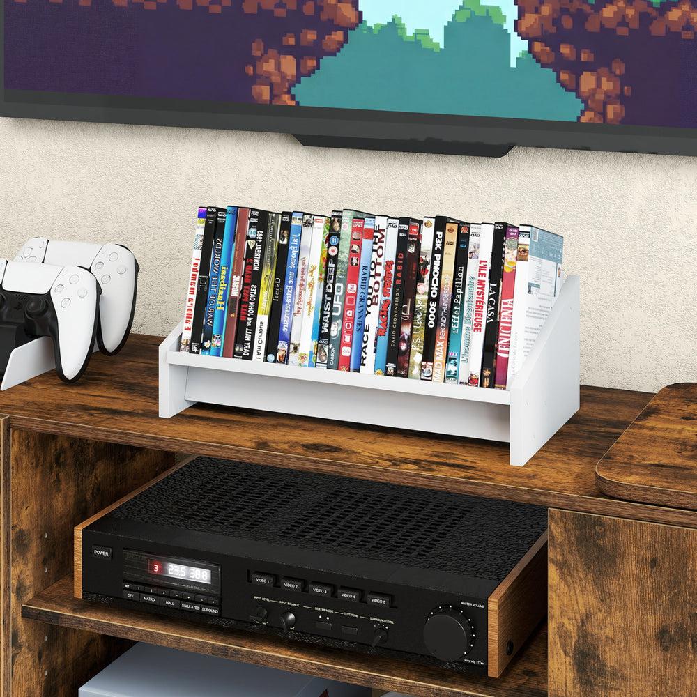 Small white wooden tilting bookshelf organizer displaying magazines and books, ideal for desktop or tabletop use.