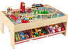 Wooden train set table with reversible tabletops, 94 accessories, and storage drawers for kids' imaginative play.