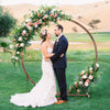 Wooden round wedding arch made of natural fir wood, ideal for outdoor ceremonies and floral decorations.