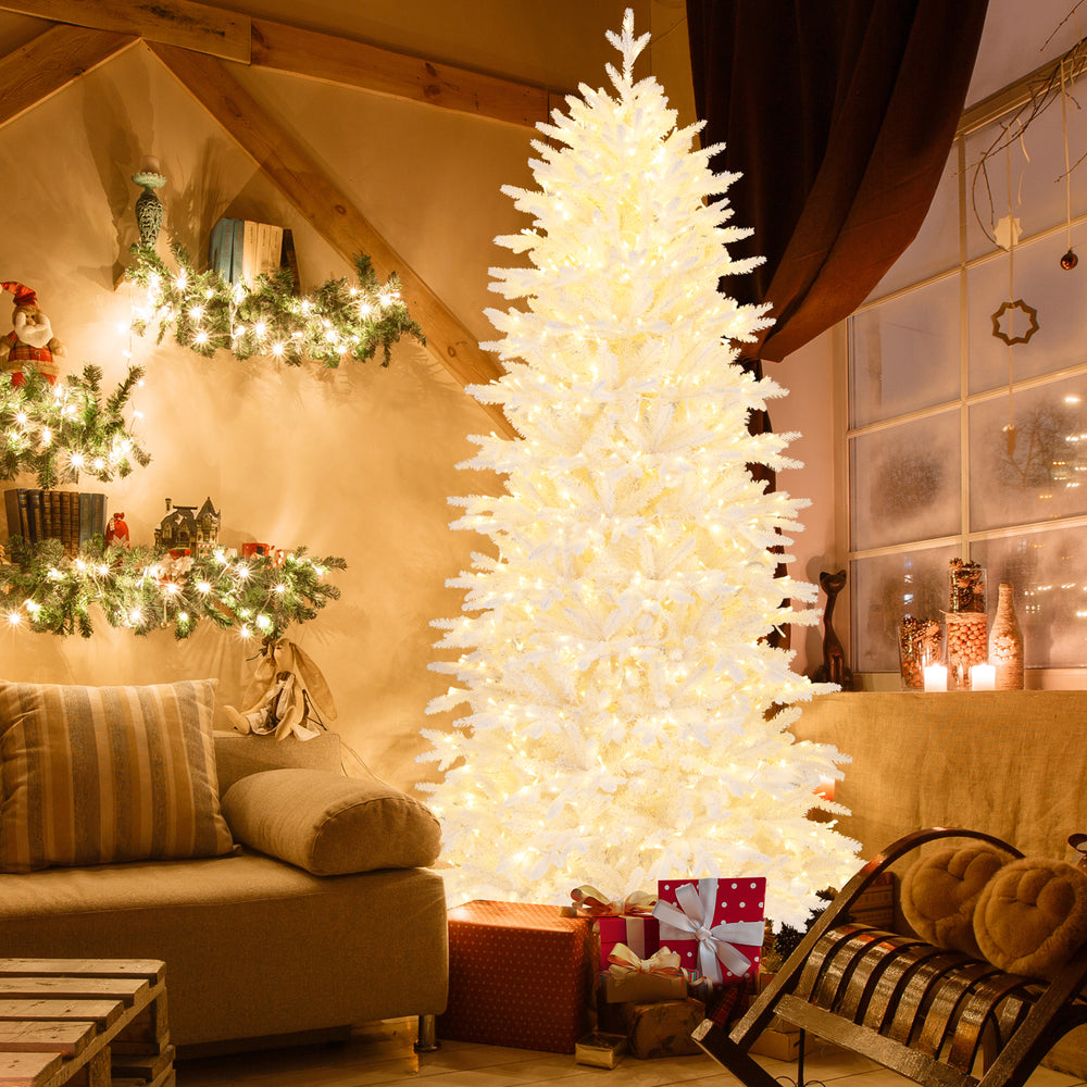 7 FT artificial Christmas tree with 1880 flocked branch tips, illuminated for a festive holiday ambiance in a cozy.