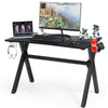 Ergonomic gaming desk with a large PVC carbon fiber surface, cup holder, and headphone hook for organized gaming setup.