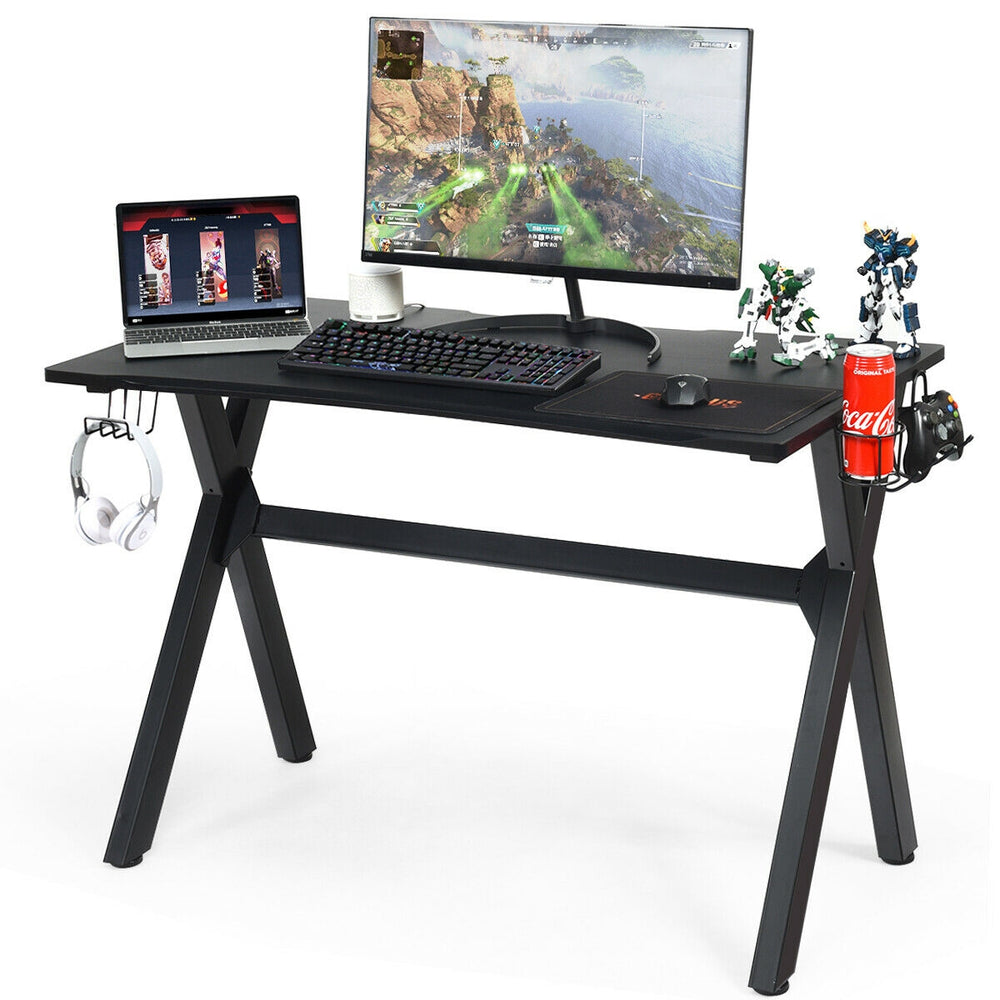Ergonomic gaming desk with a large PVC carbon fiber surface, cup holder, and headphone hook for organized gaming setup.