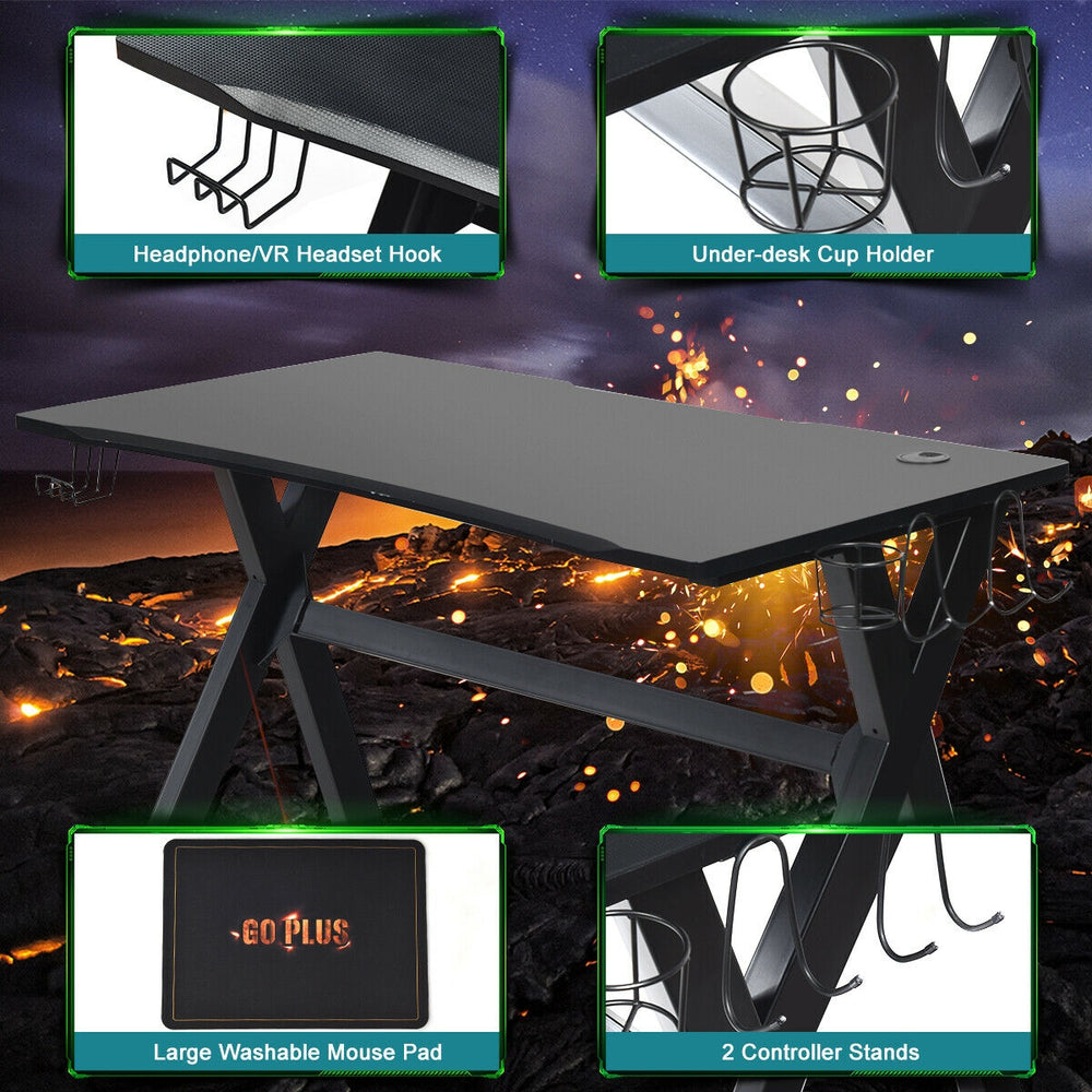 Ergonomic gaming desk featuring a PVC carbon fiber surface, cup holder, headphone hook, and two controller stands.