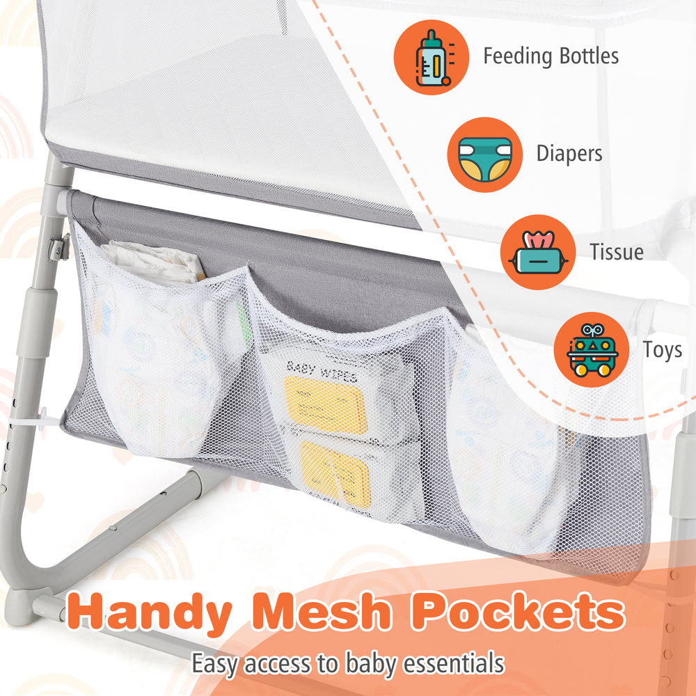 Mesh pockets for easy access to baby essentials like diapers and wipes on the Baby Bassinet Bedside Crib in gray.